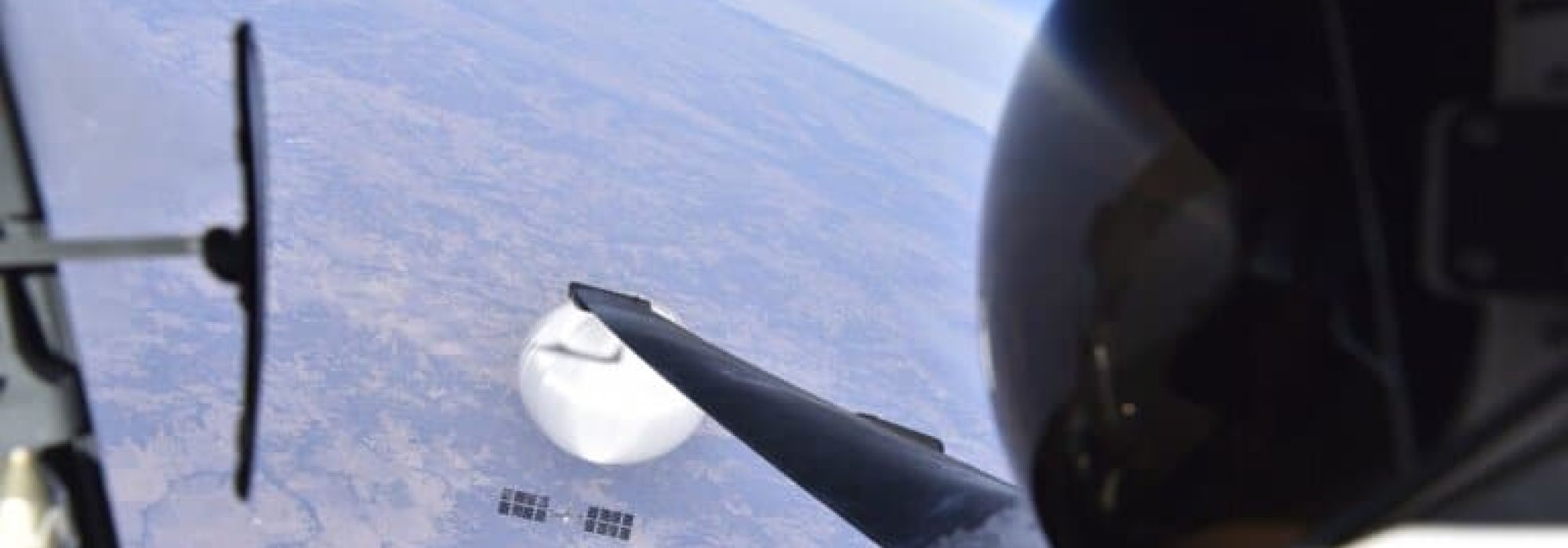 A U.S. Air Force pilot looked down at the suspected Chinese surveillance balloon as it hovered over the Central Continental United States February 3, 2023. Recovery efforts began shortly after the balloon was downed. (Photo courtesy of the Department of Defense)