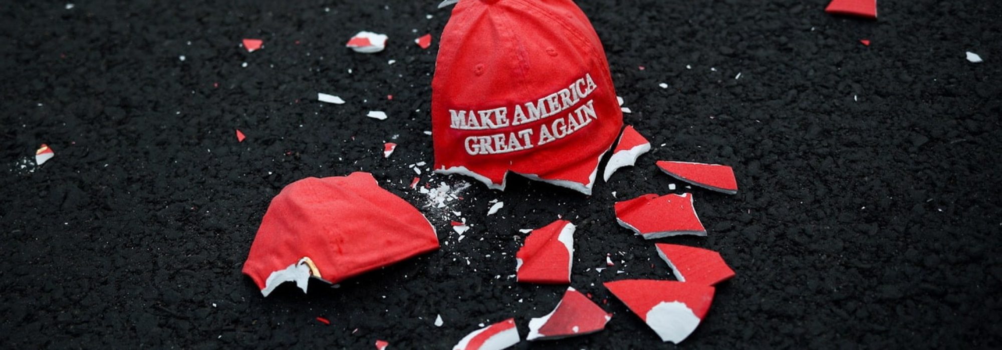 A broken "Make America Great Again" hat model, a sculpture by Connor Czora called "Make America Great Again (2020)", lies on the ground as people gather at Black Lives Matter Plaza in Washington, U.S. November 3, 2020.,Image: 567231466, License: Rights-managed, Restrictions: , Model Release: no, Credit line: HANNAH MCKAY / Reuters / Forum